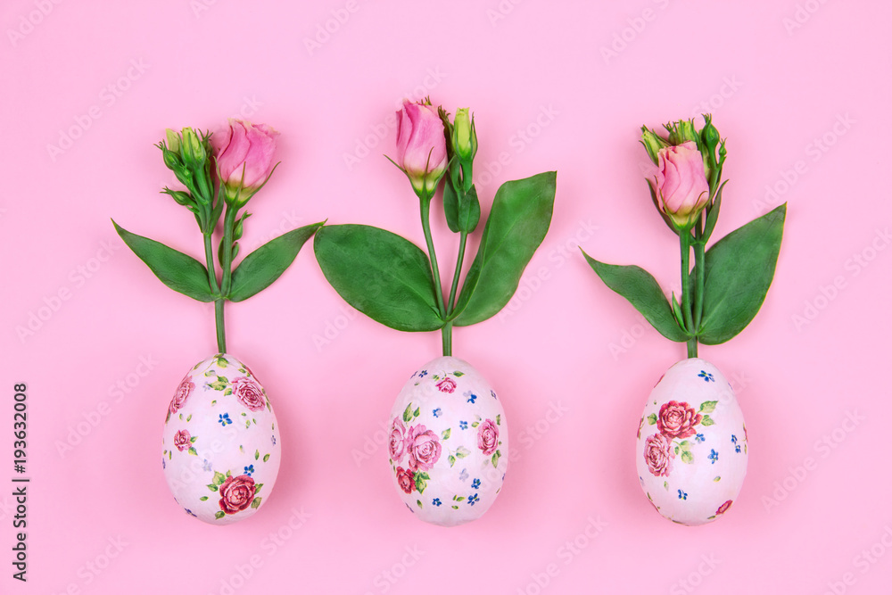 Happy Easter and Spring is coming concept. Fresh spring's red flowers roses grow from easter eggs with flower pattern on pink background. Happy Easter and Spring is coming concept. Fresh spring's red flowers roses grow from easter eggs with flower pattern on pink background.