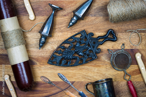 antique kitchen tools and sausage with wooden board