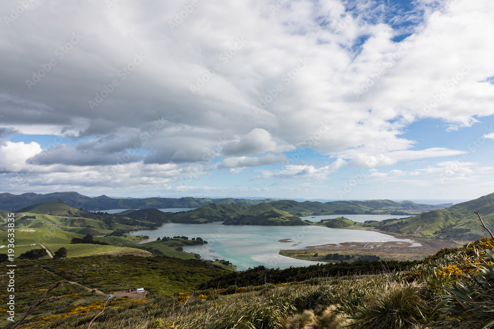 Scenic view of the coastline of New Zealand's Otago Peninsula with campervan