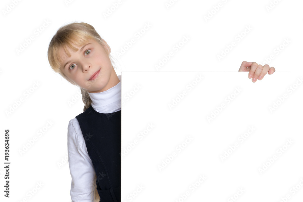 A little girl is looking from behind an empty banner. A little girl is looking from behind an empty banner.