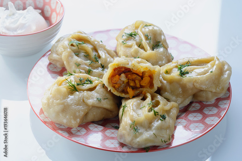 Delicious, mouth-watering dish of South Caucasian, Central Asian cuisine - Manti filled with pumpkin