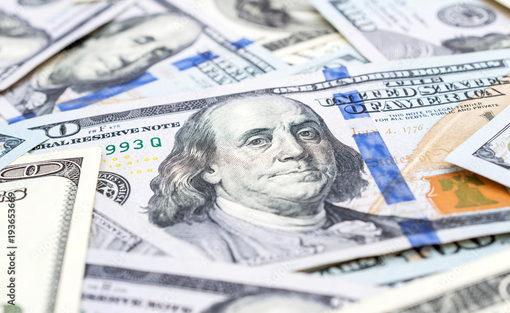 One hundred dollar bills. Close up. Business background. One hundred dollar bills. Close up. Business background.