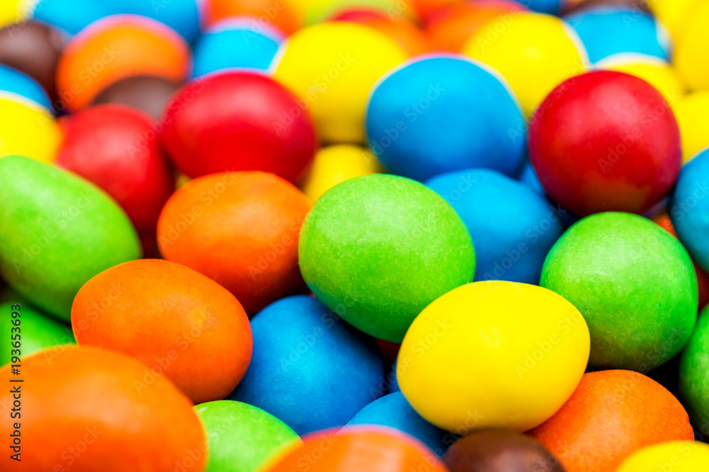 Sweet round multi colored candies. Close up. Abstract and food background. Sweet round multi colored candies. Close up. Abstract and food background.