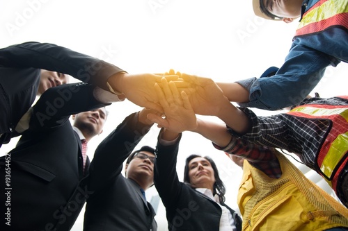 Cuadro en lienzo Hands put together to show unity and cooperation