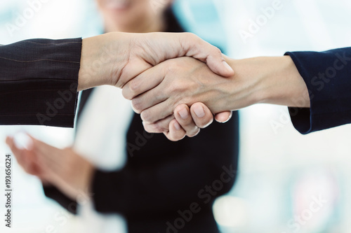 successful ideas concept business people handshake together for complete deal with blur background