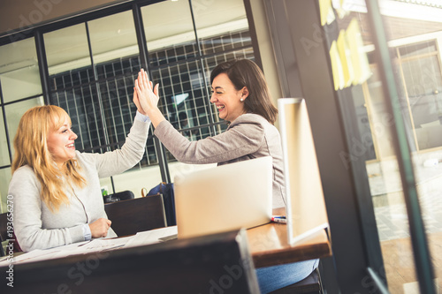 business success ideas concept with two woman hi5 with happiness and celebrate for success goal