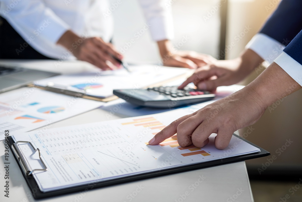 Fototapeta premium Teamwork of business colleagues consultation market growth on financial document graph report, professional occupation working analyzing startup and investment project to development grow to success
