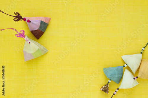 Korean traditional pachwork & knot background of yellow ramie fabric. photo