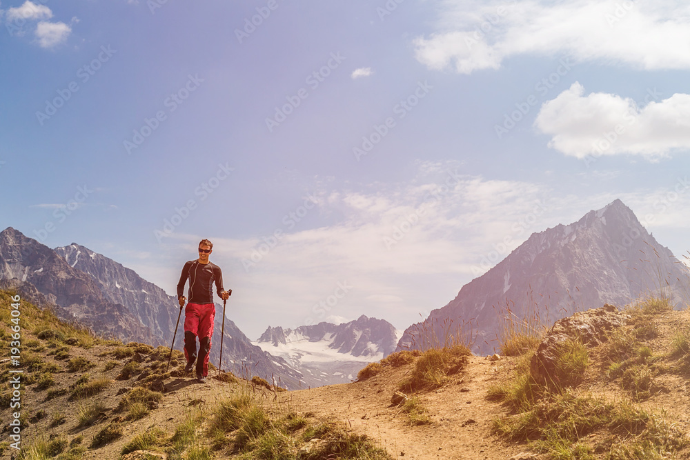 young man walking in mountains