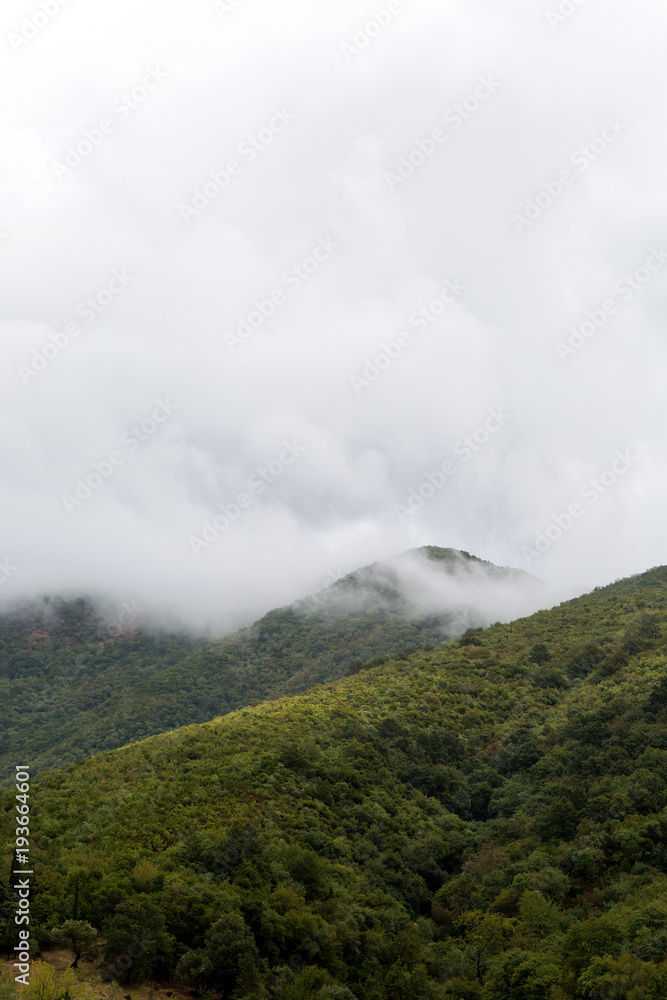 mountains in Montenegro with clouds and fog