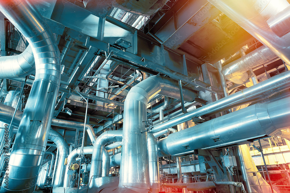 different size and shaped pipes and valves at a power plant