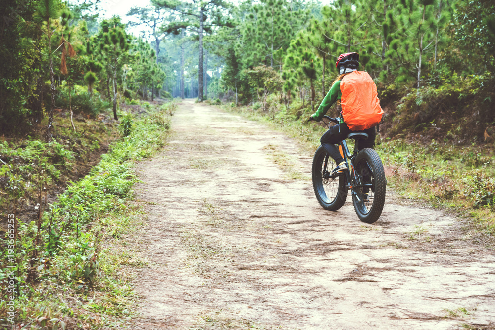 Asian women Travel photograph Nature. Travel relax ride a bike Wilderness in the wild. Thailand Asian women Travel photograph Nature. Travel relax ride a bike Wilderness in the wild. Thailand