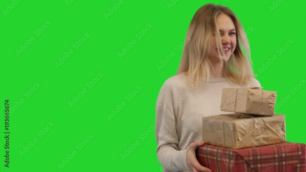 cute girls takes gift boxes on a green screen cute girls takes gift boxes on a green screen