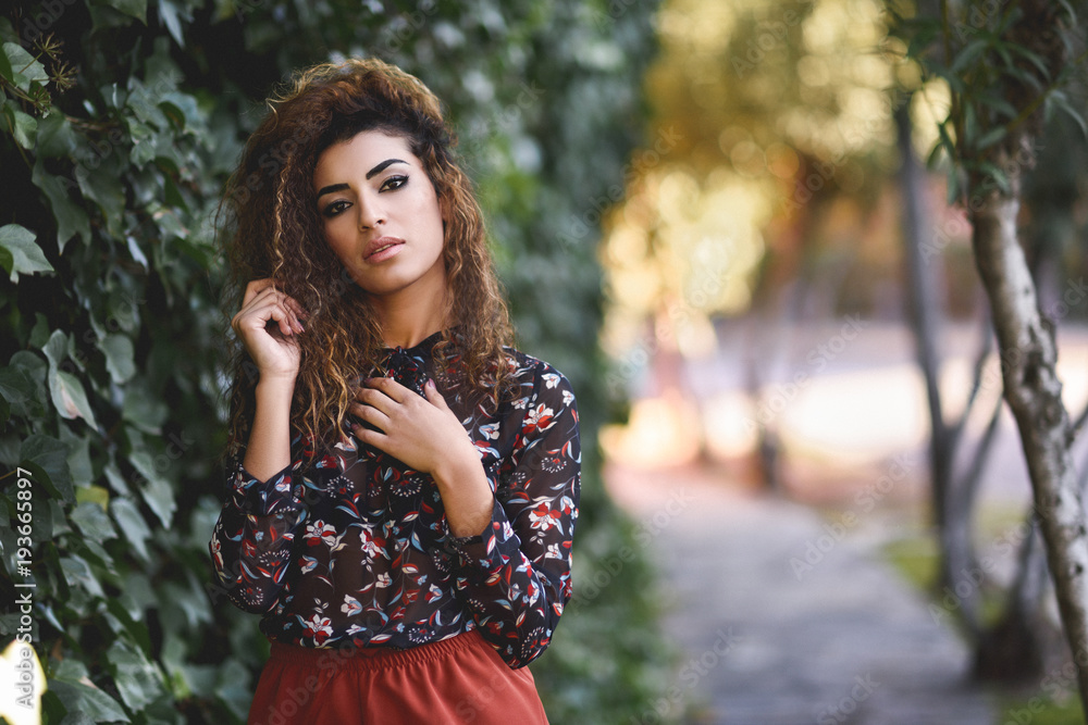 Beautiful young arabic woman with black curly hairstyle. Beautiful young arabic woman with black curly hairstyle.