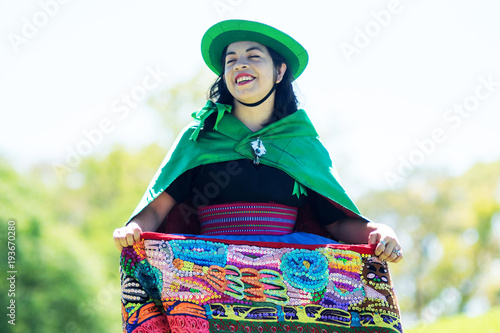 Portrait of a young woman dancing Huayno, a traditional musical genre typical of the Andean region of Peru, Bolivia, northern Argentina and northern Chile photo