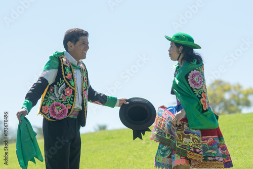 Peruvian couple dancing Huayno, a traditional musical genre typical of the Andean region of Peru, Bolivia, northern Argentina and northern Chile photo