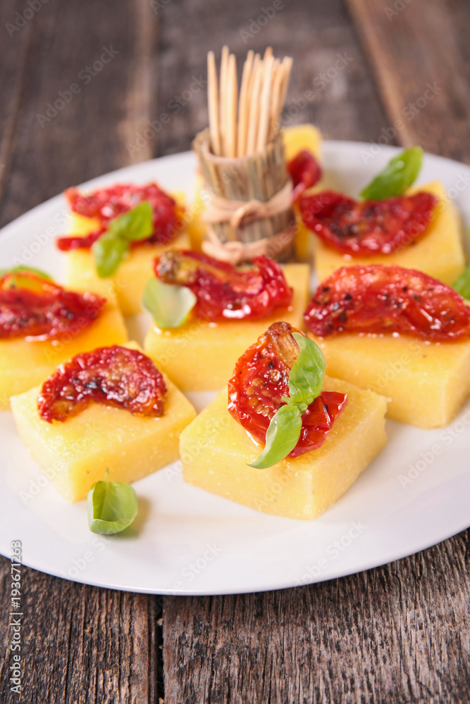 polenta and dry tomato, finger food polenta and dry tomato, finger food