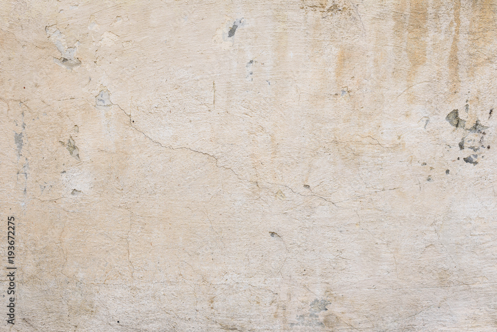 Fototapeta premium Wall fragment with scratches and cracks