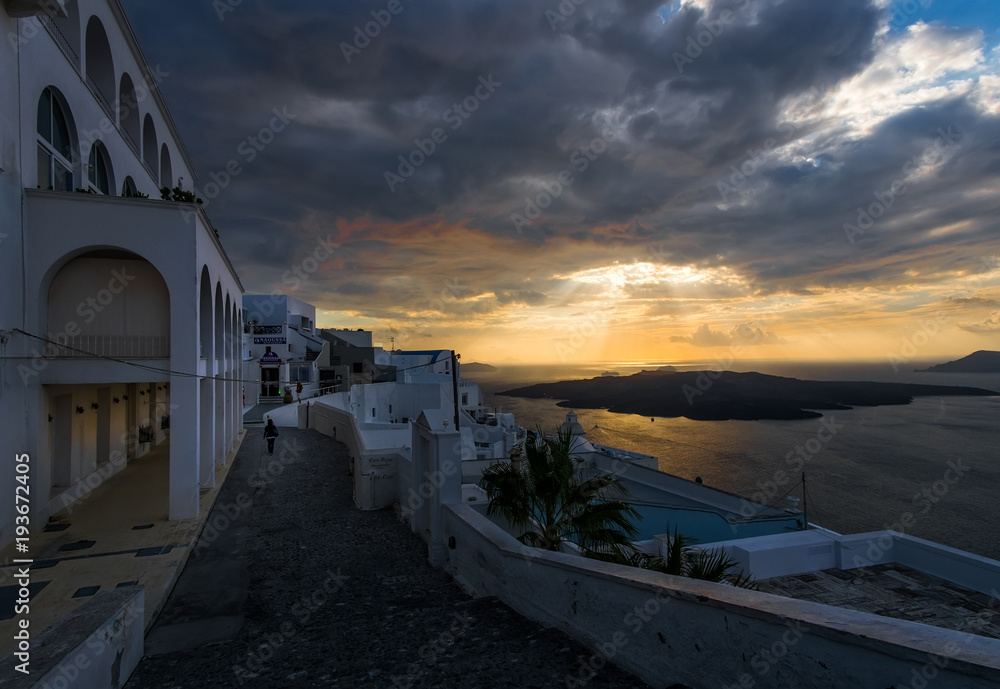 Pink sunset over the white city of the island of Santorini. Greece