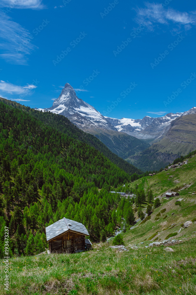 A mountain hut with a view of Matterhorn on a hiking trail in Zermatt, Switzerland