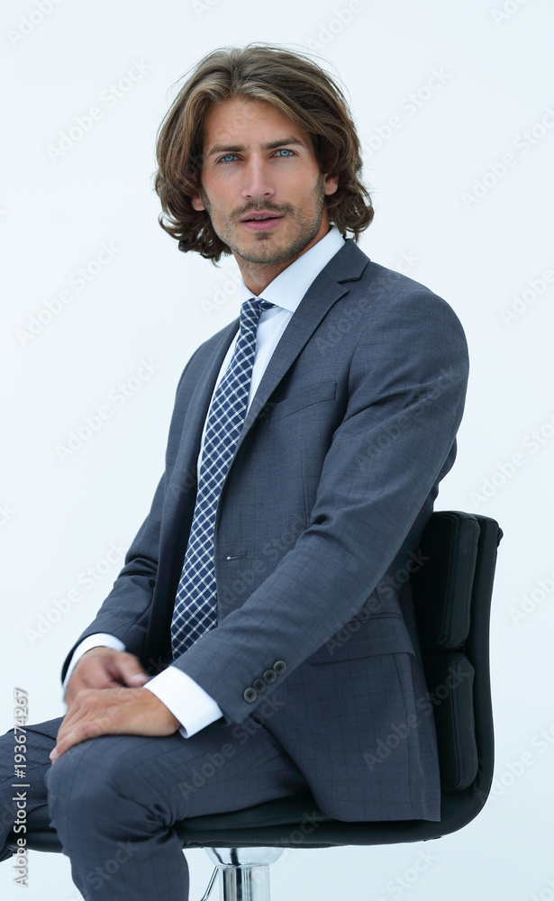 Inviting business man sitting on chair with relaxed attitude Inviting business man sitting on chair with relaxed attitude