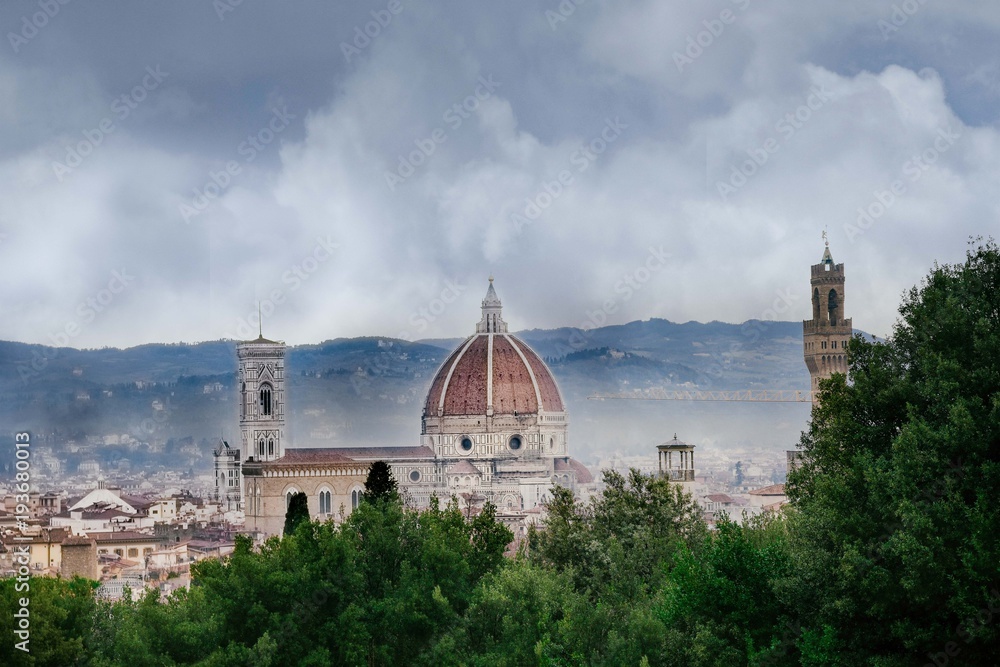 rainy day in Florence, the sky with dark clouds over the dome of the Cathedral of Santa Maria del Fiore and the bell tower of Giotto