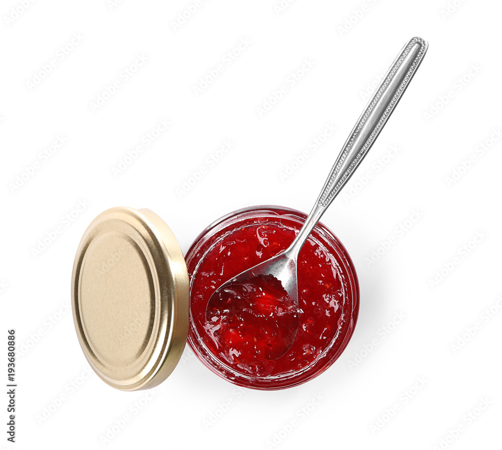 Jar and spoon with sweet jam on white background Jar and spoon with sweet jam on white background