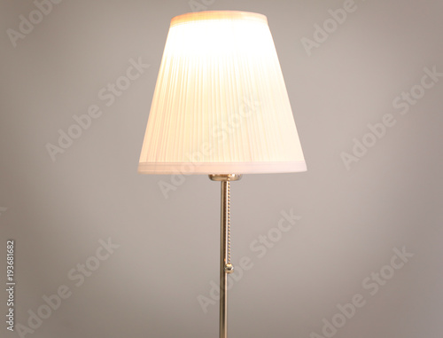 Stylish lamp on light background