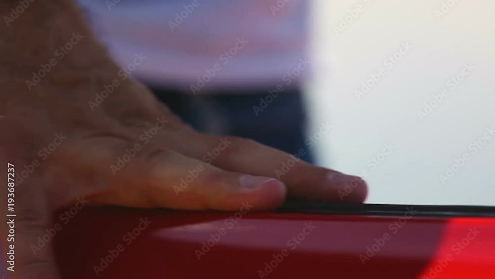 Male hand opening door of red auto, driver or passenger ready for trip by car Male hand opening door of red auto, driver or passenger ready for trip by car