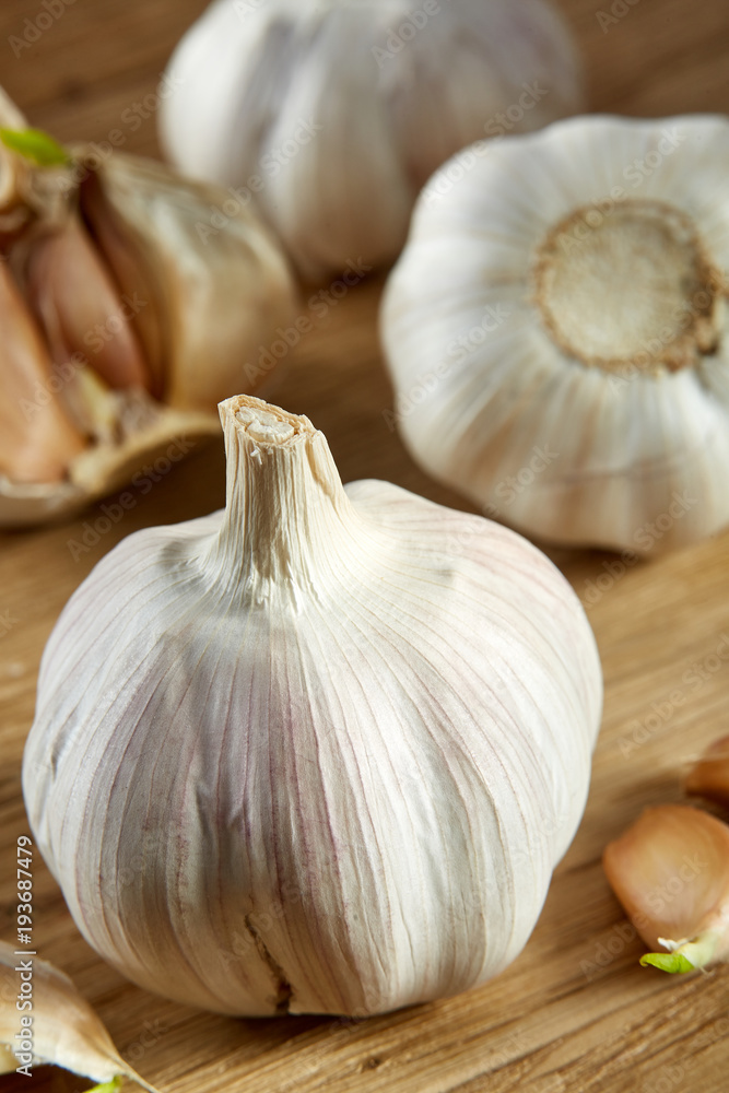 Garlic close up on rustic wooden background, shallow depth of field, selective focus, macro Garlic close up on rustic wooden background, shallow depth of field, selective focus, macro
