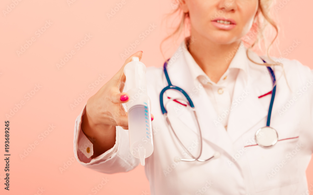 Nurse with big syringe.