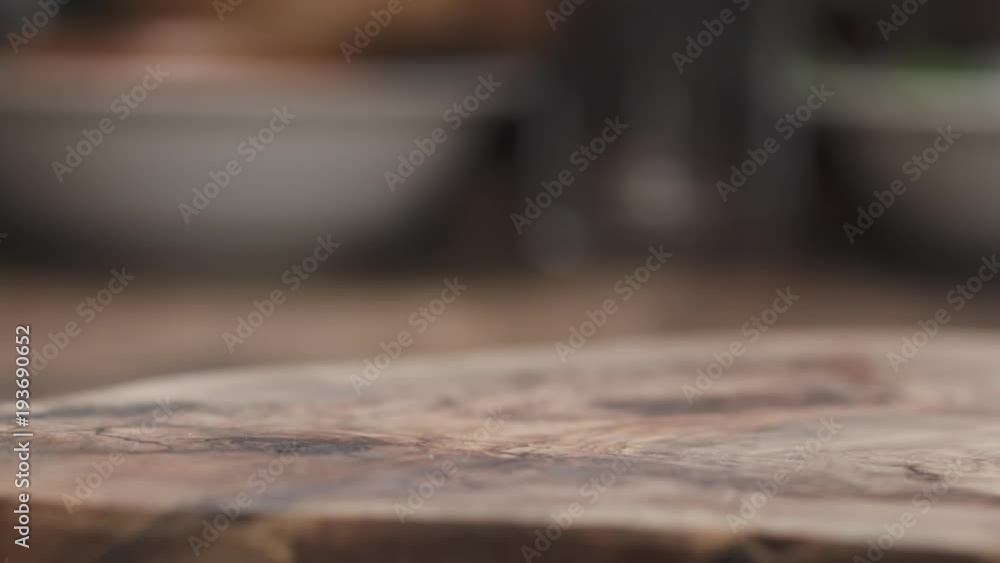Slow motion of Italian coppa ham falling on wood board closeup Slow motion of Italian coppa ham falling on wood board closeup