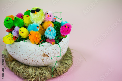 Easter basket with lots of little chicks, pastel background