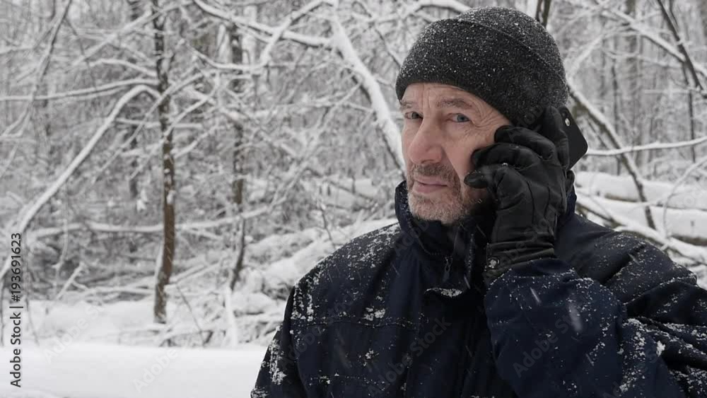 Elderly Bearded Man Talking On Mobile Phone In The Winter Snow In The Forest Timelapse Elderly Bearded Man Talking On Mobile Phone In The Winter Snow In The Forest Timelapse