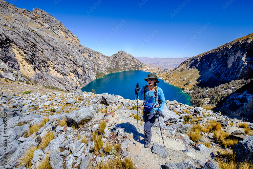 Young woman hiking near Churup Lake in the Huascaran National Park, Peru.