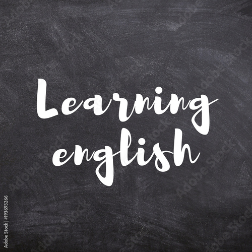 Learning English title on School Blackboard. Education and business concept.