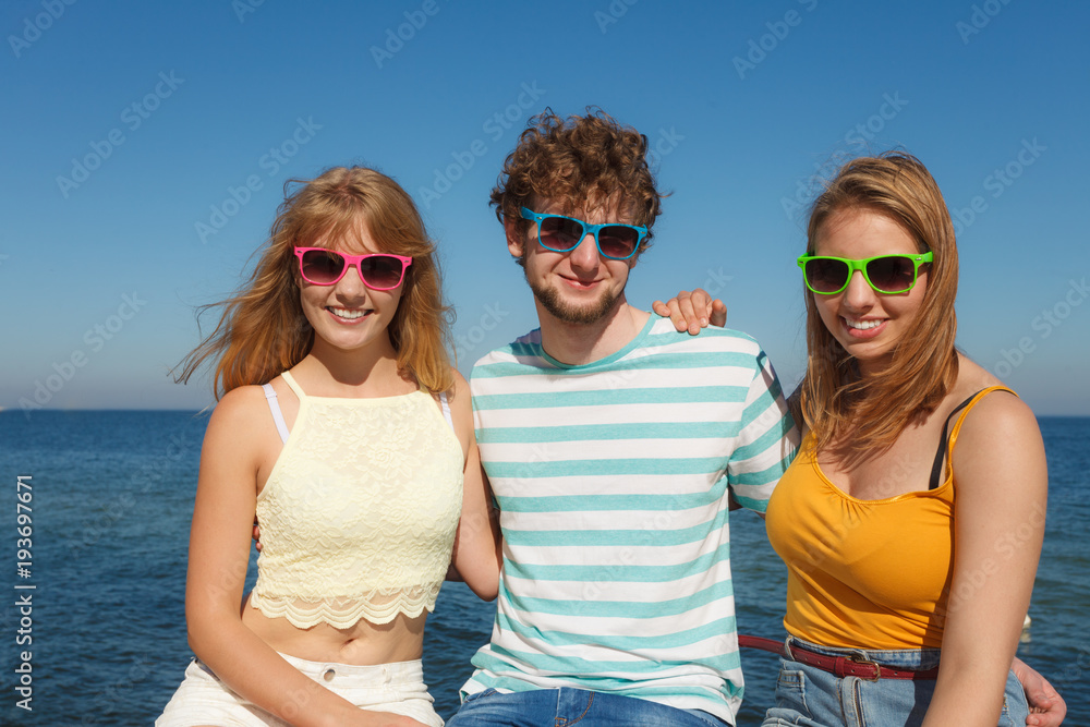 Group friends boy two girls having fun outdoor