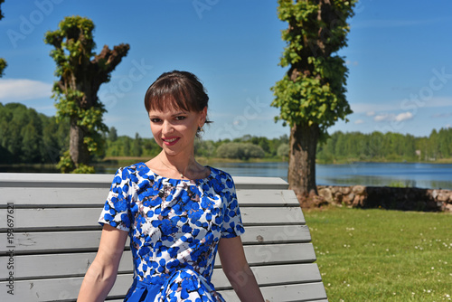 Young woman in summer park photo