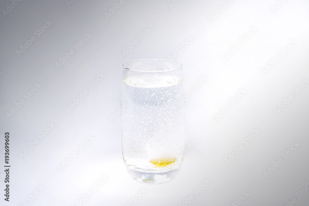 Vitamin C in glass with water. Abstract photo of healthy. Vitamin C in glass with water. Abstract photo of healthy.