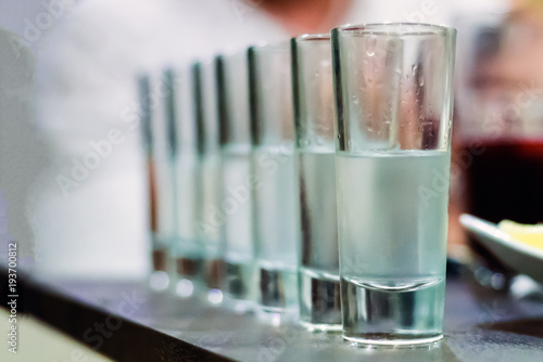 Tableau sur toile row of glasses for vodka shot