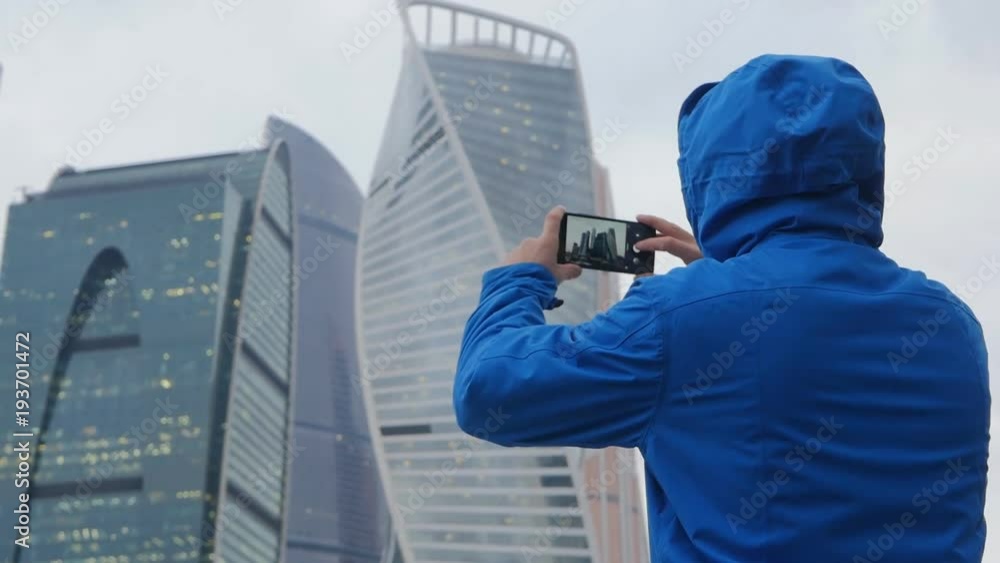 Man takes photo or video on smartphone Man takes photo or video on smartphone