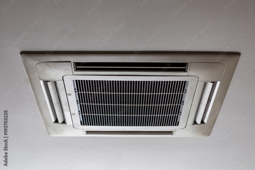 Old cassette type, air condition installation on white ceiling. Stock Photo  | Adobe Stock