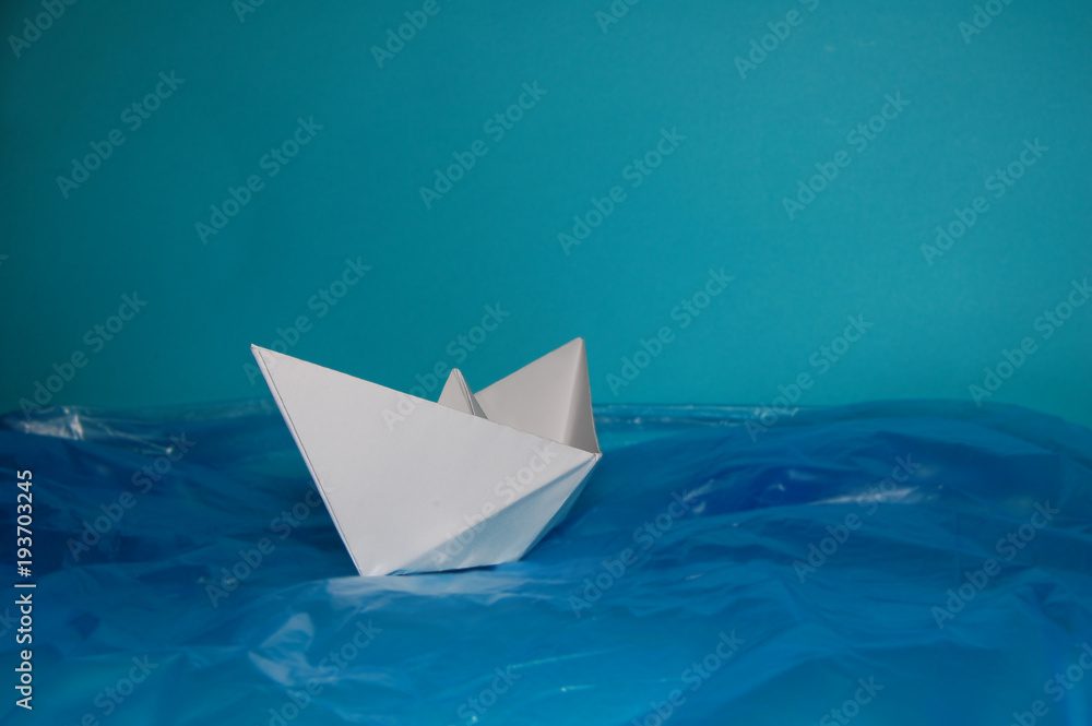 Obraz premium Paper boat in the Plastic Sea