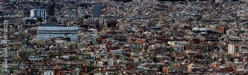 panoramic aerial cityscape view of the barcelona cityscape showing densely crowded buildings towers and streets © Philip J Openshaw 