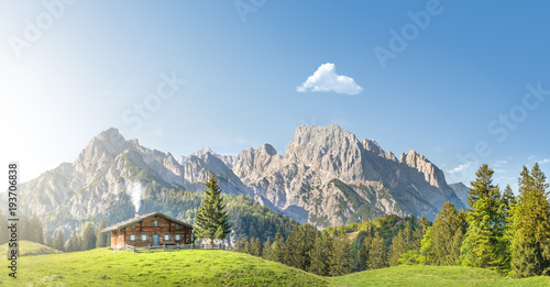 Chalet in front of mountains