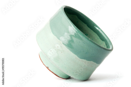 green pottery cup