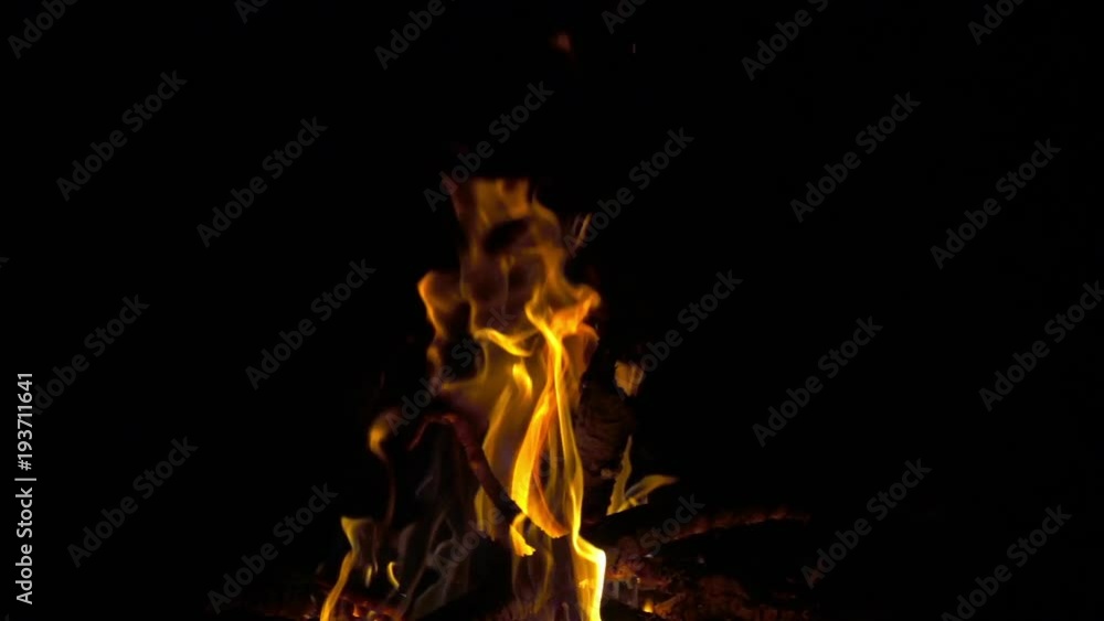 Saturated yellow fire of campfire at night, 8x 240 fps slow motion, full hd 1080p video footage Saturated yellow fire of campfire at night, 8x 240 fps slow motion, full hd 1080p video footage