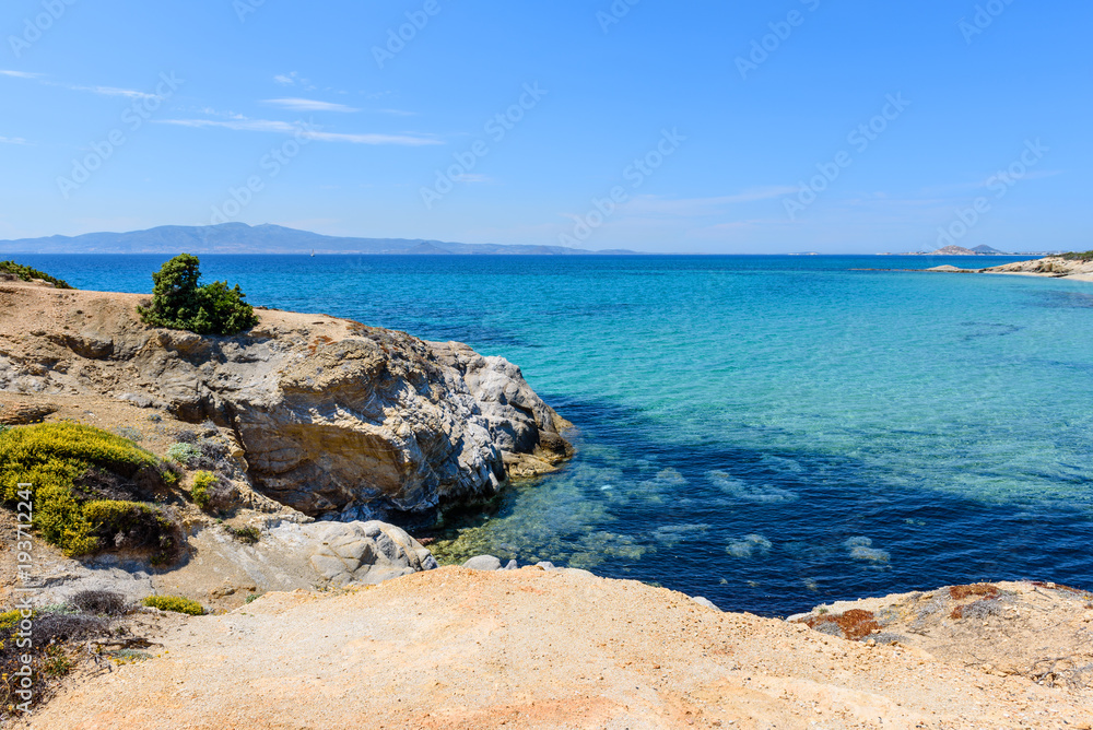 Crystal clear sea water at Aliko beach on Naxos island. Cyclades, Greece