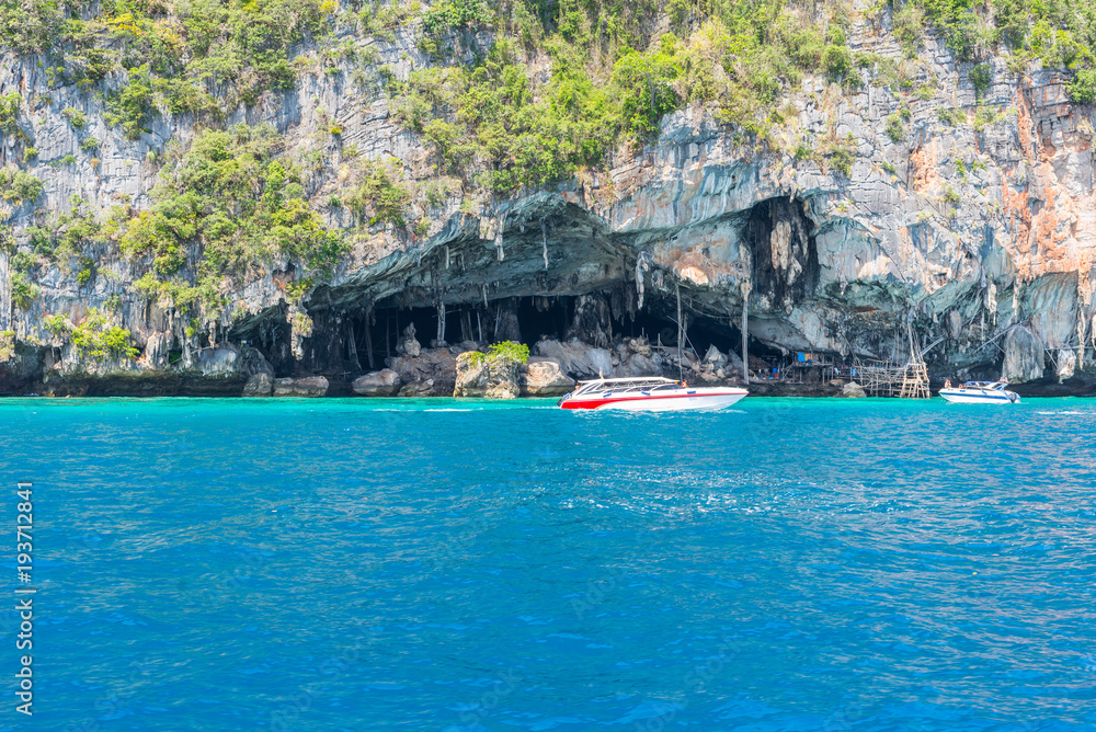 Boats in front of the Viking Cave. Ko Phi Phi Leh is well known for its horrible mass tourism