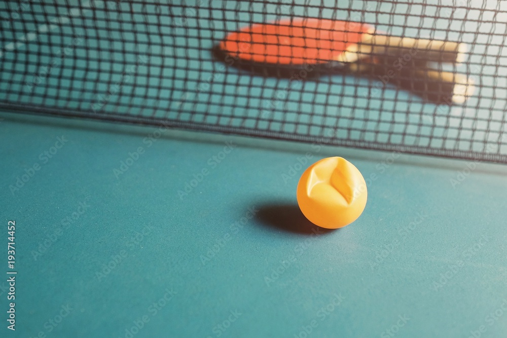 Copy Space and Soft focus at broken ping pong ball on the table tennis /  Soft light